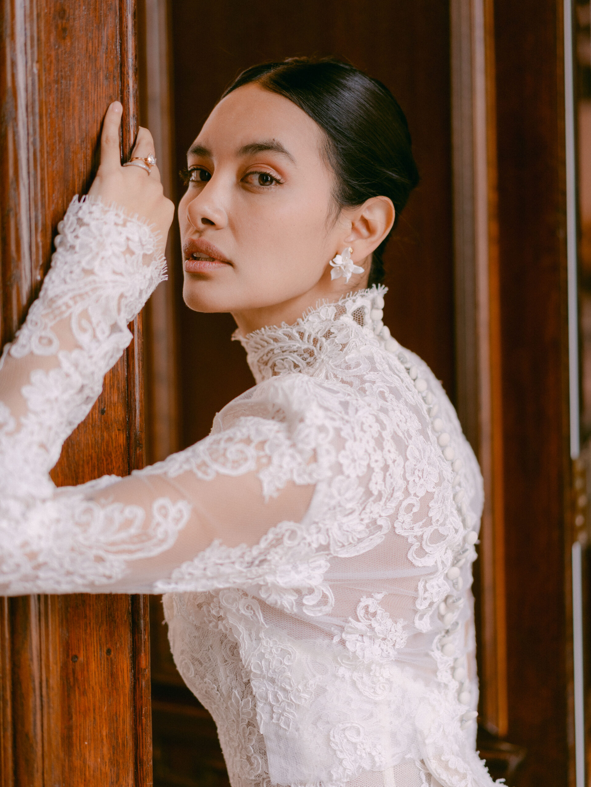 Beautiful bride wearing lace wedding dress looking elegant