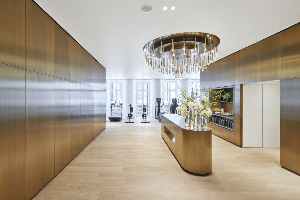 Interior of Lanserhof at the Arts Club Private Health and Wellness Clinic featuring a luxury gym reception area. They offer many beauty treatments to achieve the perfect bridal glow