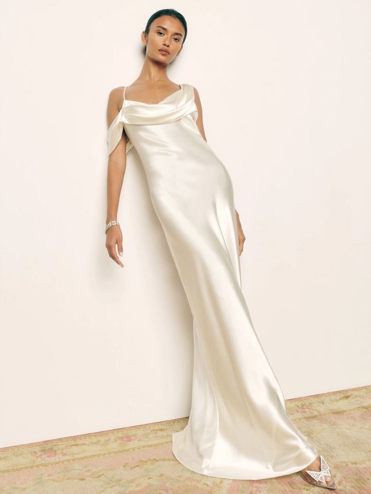 A bride wearing a sleek, sustainable satin wedding gown made from eco-friendly materials for a modern, conscious celebration.